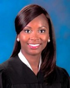 Image of a smiling woman in judicial robe (Jessica Costello)