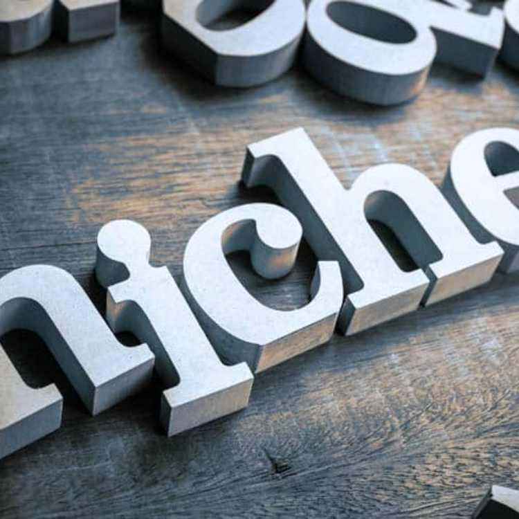 Cut-out letters spelling the word niche